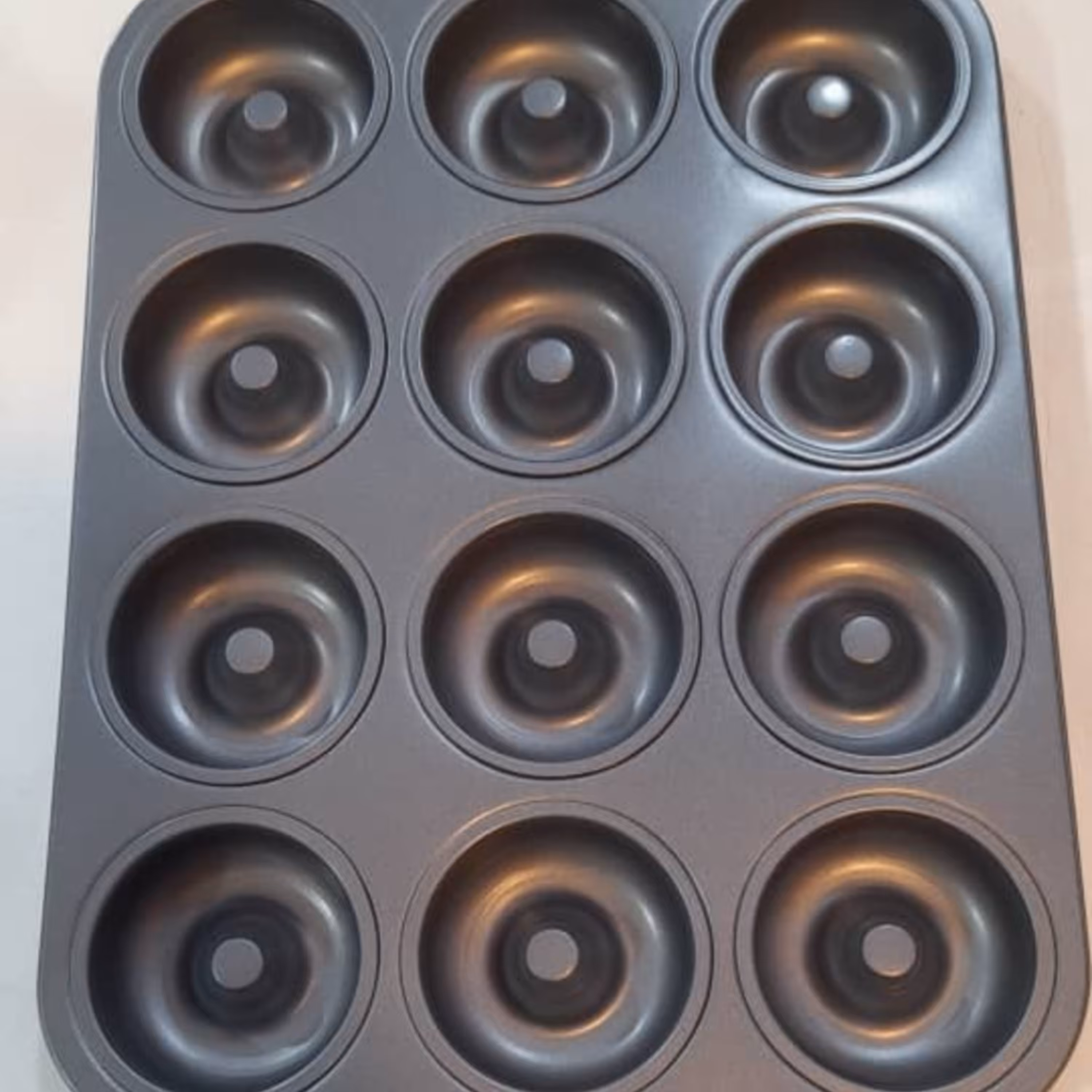 قالب دونات12خانه تفلون ابعاد27در35 وزن 530 گرم