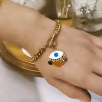 دستبند کارتیه با آویز چشم نظر  استاینلس استیل رنگ ثابت بدلیجات مشابه طلا اکسسوری وزیورآلات دخترانه وزنانه  آویز دار