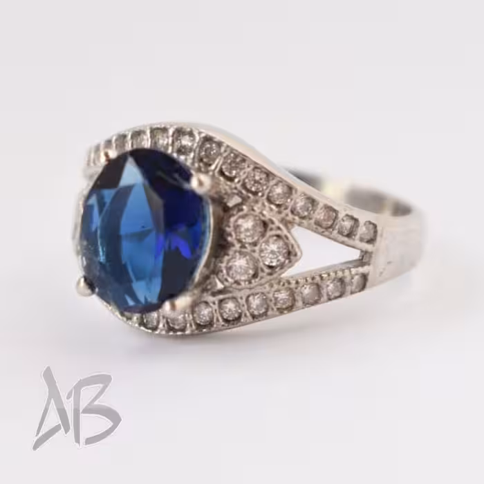 انگشترنقره زنانه نگین آبی آبکاری طلا  عیار 925 آقابزرگ