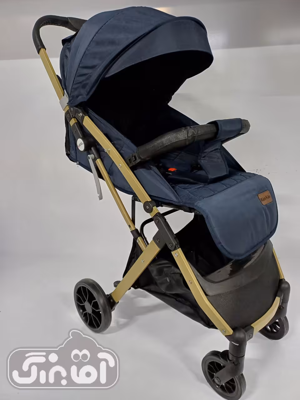 کالسکه مسافرتی ریچ کیدز rich kids مدل baby5 سرمه ای بدنه طلایی