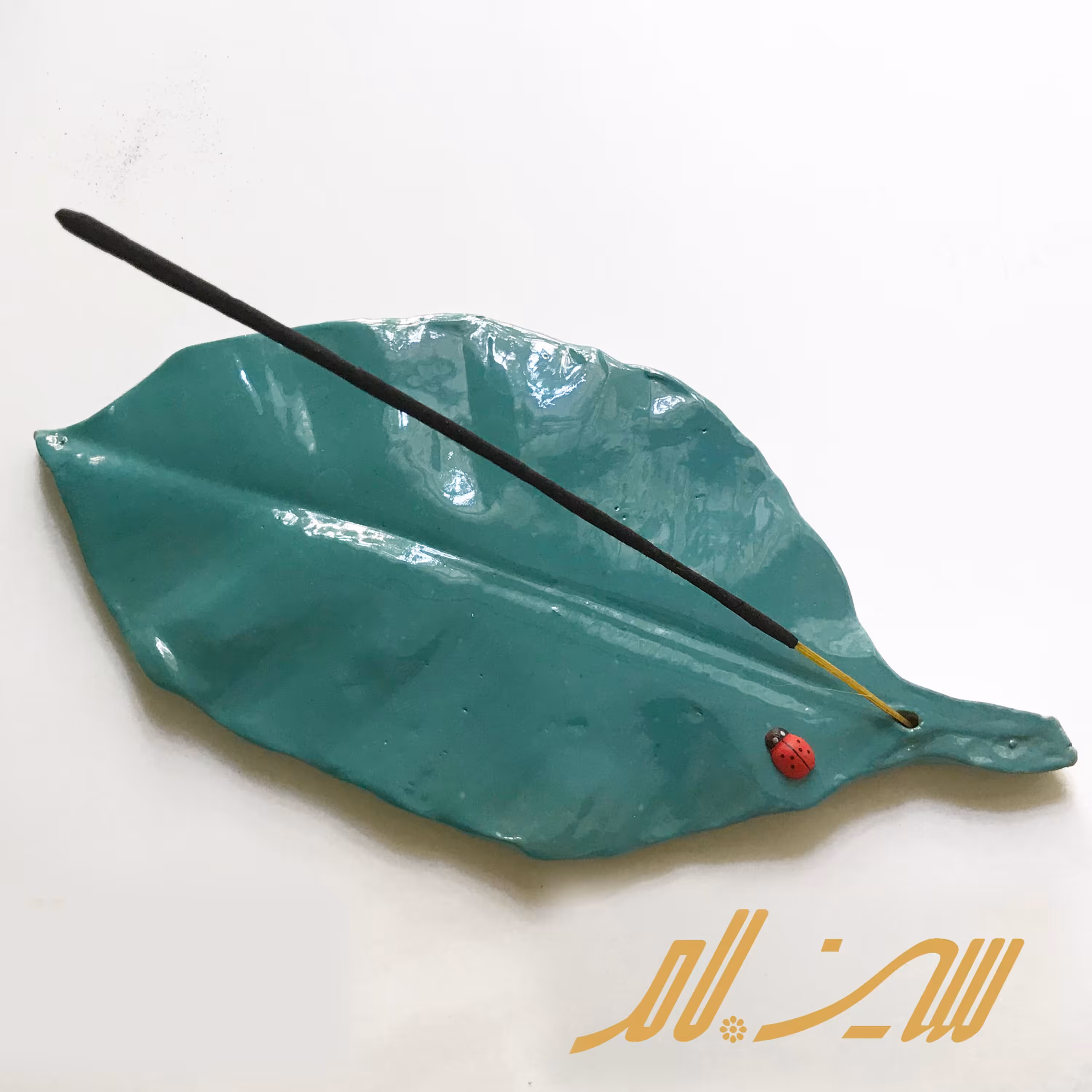 جا عود فرم برگ- سفال رنگ فیروزه ای - اندازه 27 در 12.5