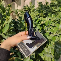 عطر طرح کفشی گودگرل مشکی

