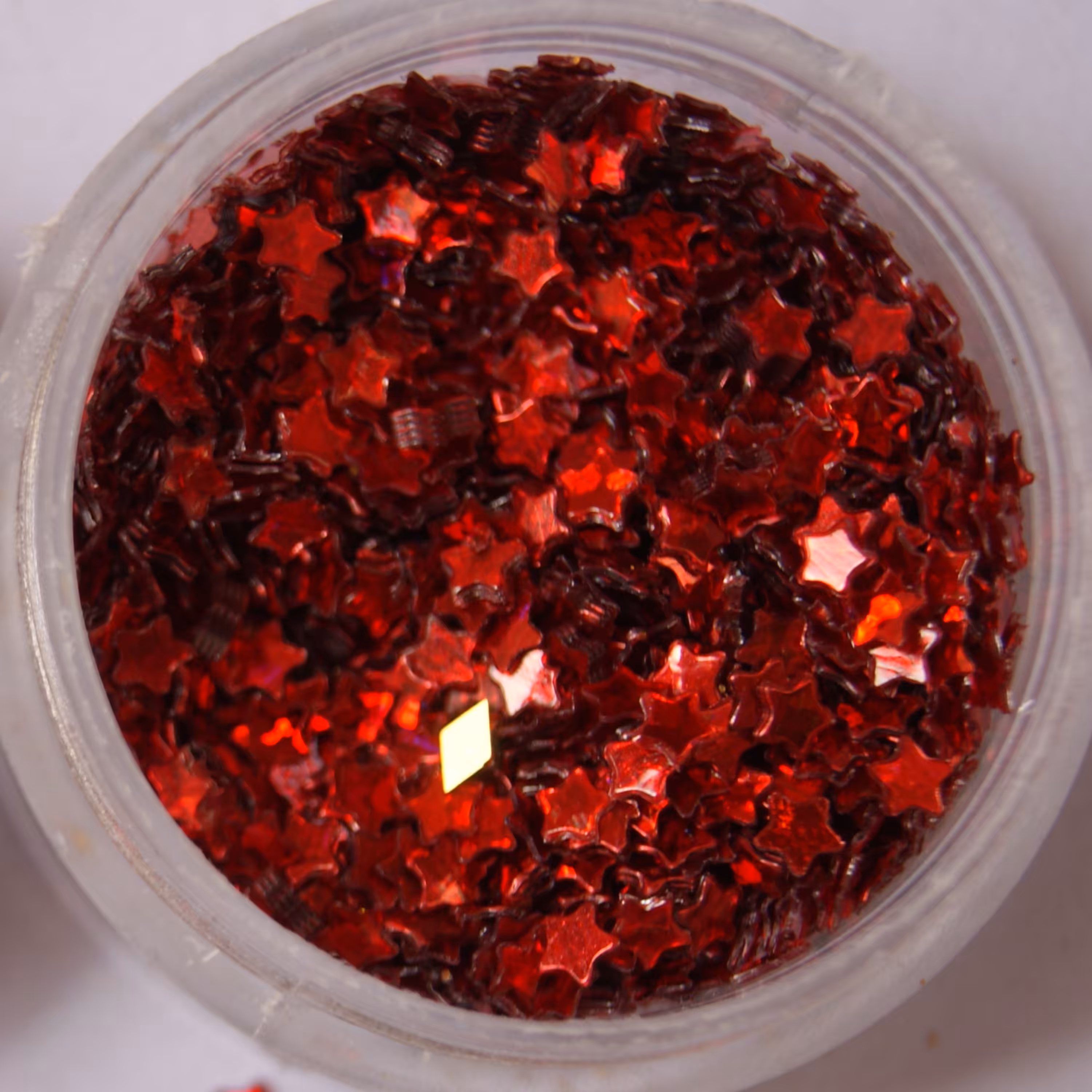 پولک ستاره ریز به رنگ قرمز در بسته های 10 گرمی