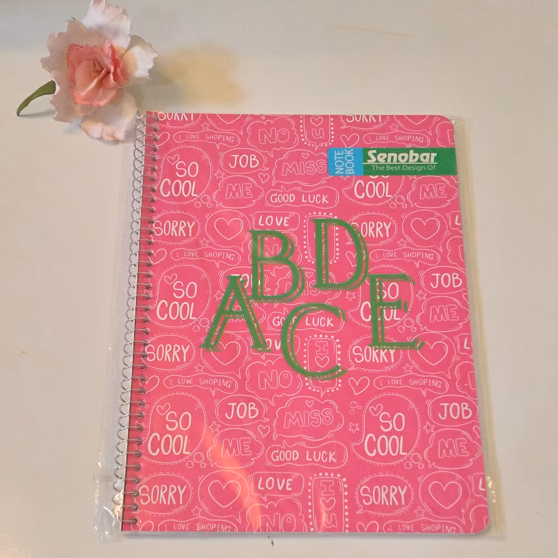 دفتر زبان 50 برگ سیمی صنوبر طرح حروف الفبا صورتی جلد طلقی