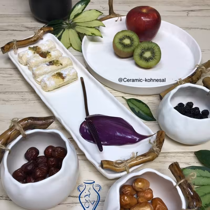 سرویس پذیرایی سرامیکی شامل میوه خوری رولت خوری وسه عدد پیاله