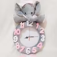 ساعت دیواری عروسکی طرح فیل نانان دخترونه جنس مخمل 