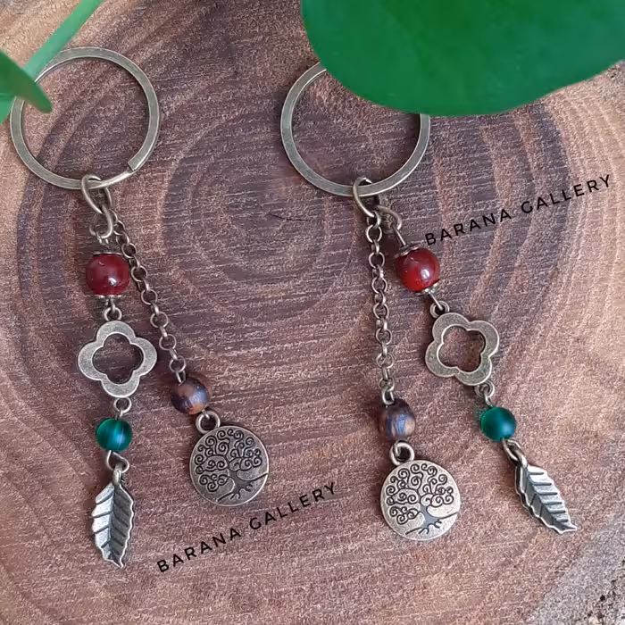 جاکلیدی جاسوئیچی(سرکلیدی) درخت دوستی گل و برگ قرمز  قهوه ای آویزدار بلند زنجیر دار زنانه مردانه دخترانه پسرانه 