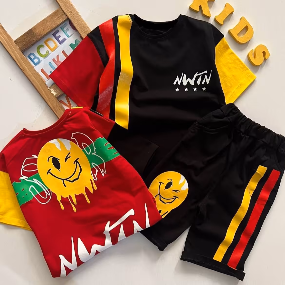 ست بلوز و شلوارک استیکر 2 خط پسرانه 