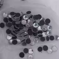 نگین حرارتی پشت مشکی مارک dmc سایز 30 بسته 10عددی نقره ای 