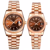 ست ساعت مچی عقربه ای زنانه و مردانه اوبلاک مدل 72692رنگ رزگلد صفحه کافی