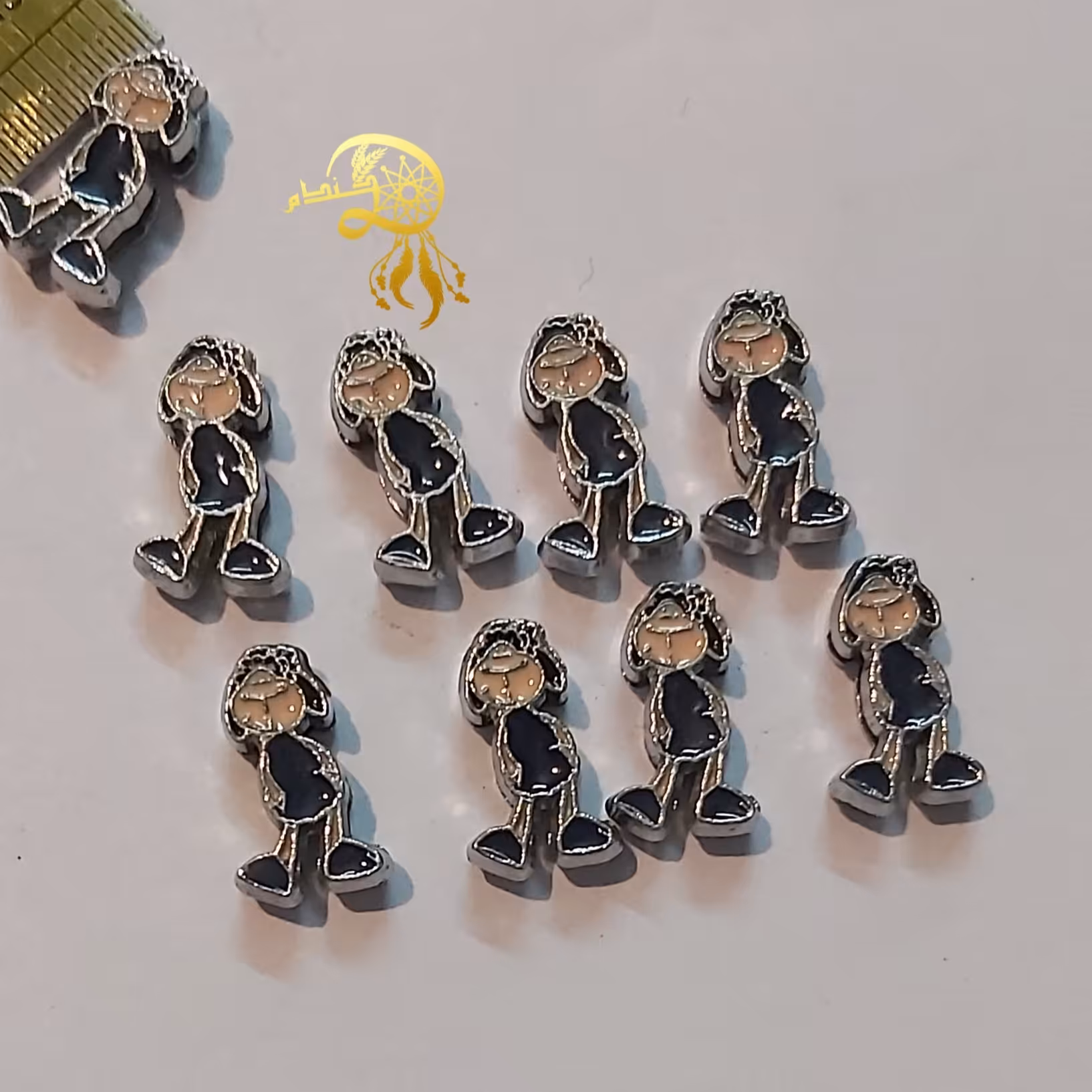 خرجکارپسربچه فلزی لباس مشکی یک سانتی یک عدد