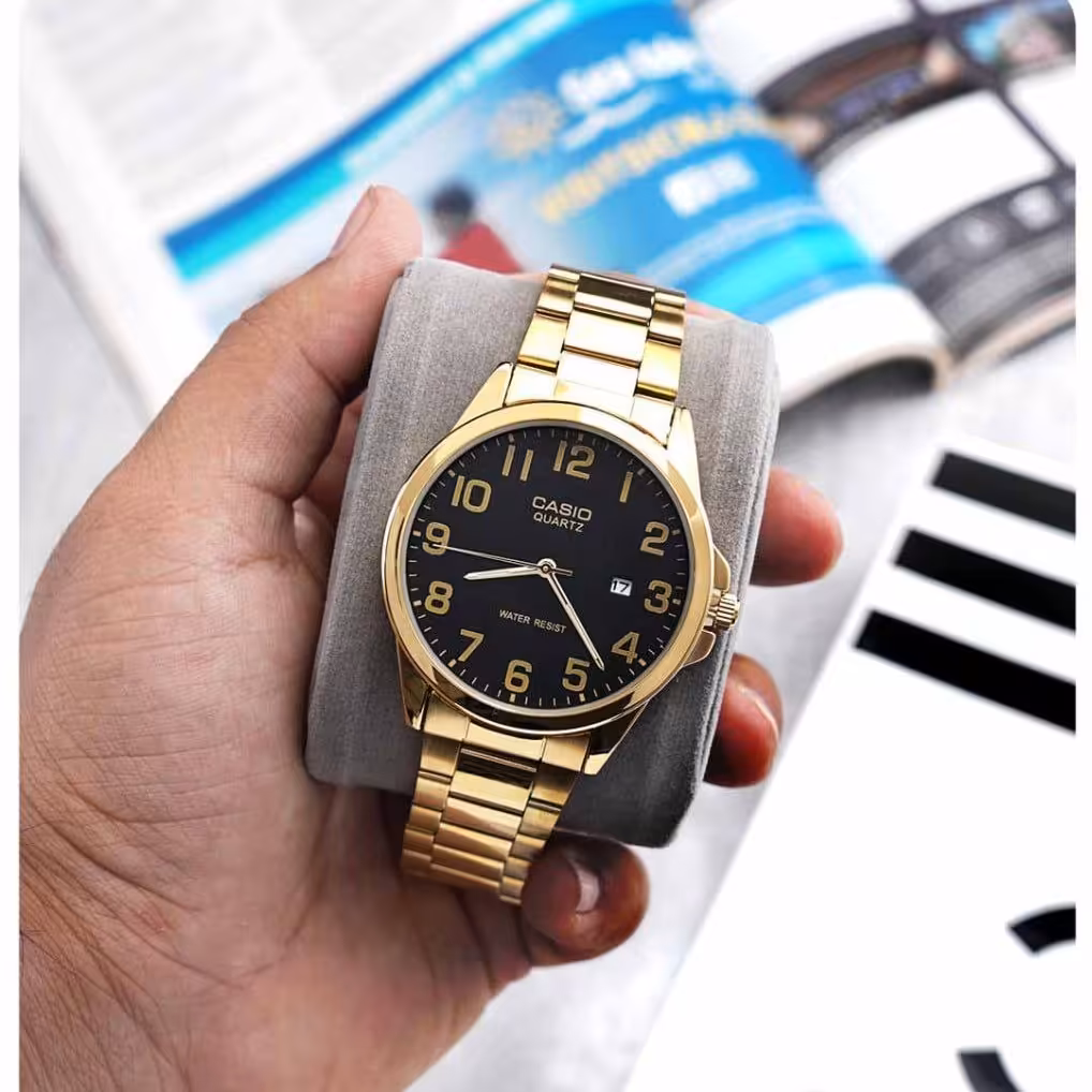 ساعت مچی کاسیو مردانه طلایی مدل 1557 casio باجعبه و باتری اضافه 