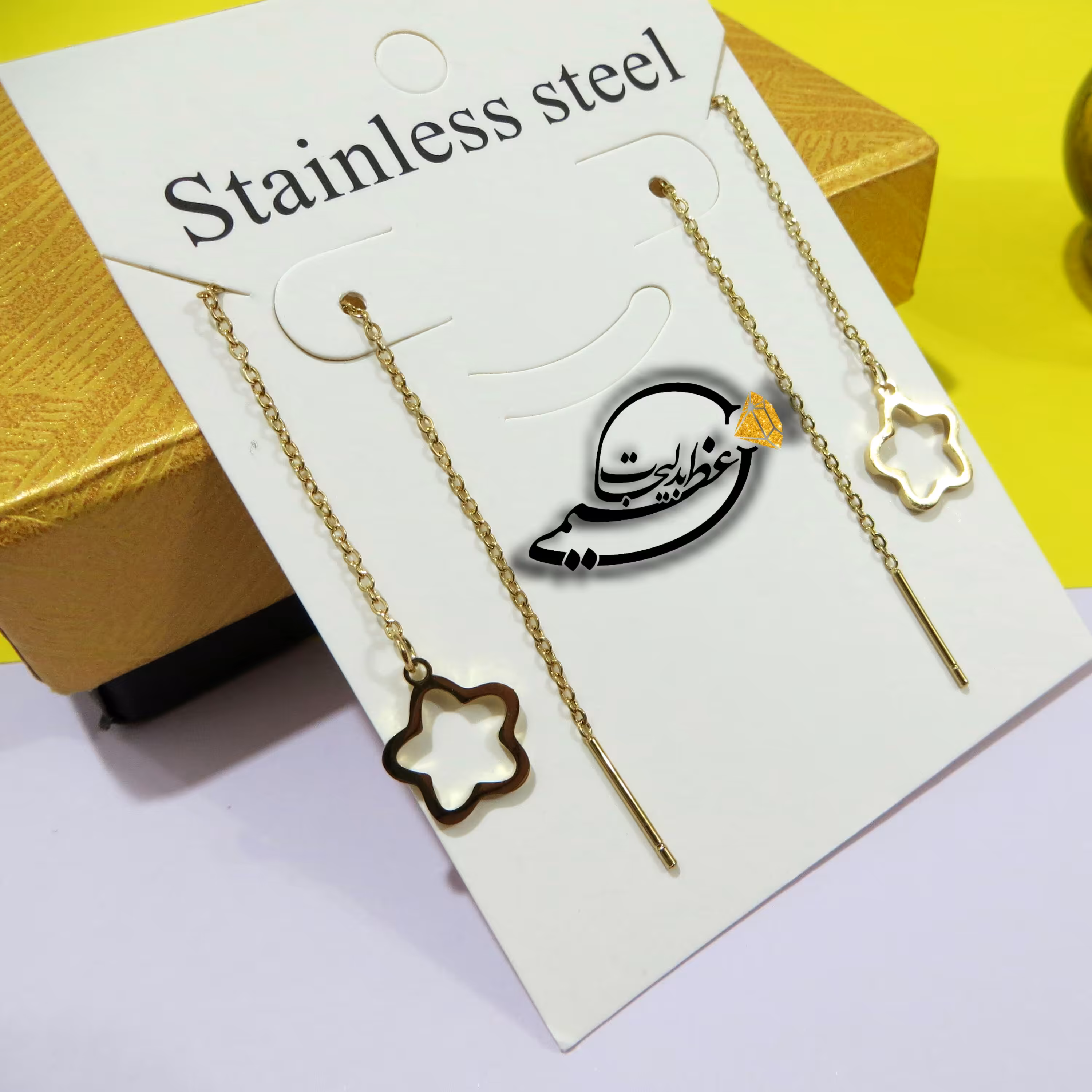 گوشواره بخیه ای استیل رنگ ثابت با کیفیت طرح پنچ پر طلایی