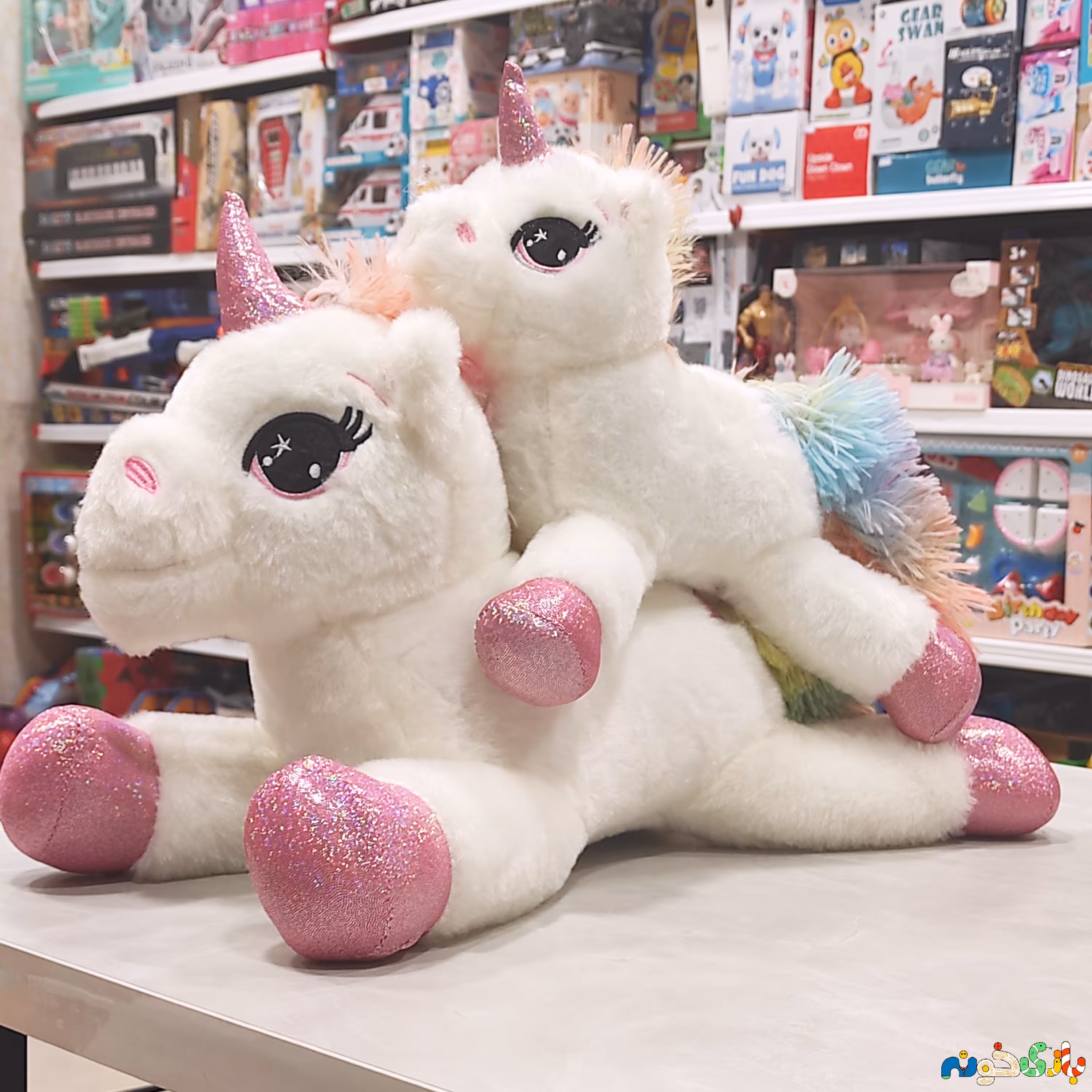 عروسک پولیشی تک شاخ خوابیده شاخ و پا اکلیلی وارداتی طول 43 سانت 