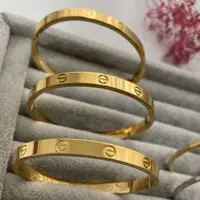 دستبند کارتیر استیل بیضی و مربع رنگش طلایی و سفید