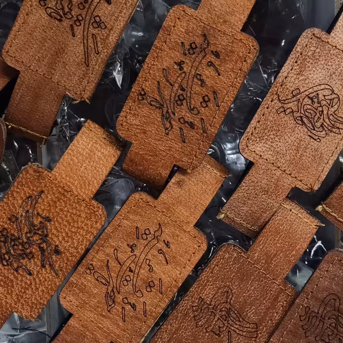 بسته50عددی بازوبند چرم طبیعی همراه با حرز امام جواد کامل چاپ کاغذی