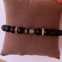 دستبند زنانه و دخترانه اسپرت کلاسیک اونیکس و گوی سوارسکی و حروف نیل(سفارشی) 