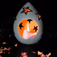 شمعدان سفالی رنگ شده طرح ستاره و پرنده طوسی و صورتی ارتفاع 15 سانتی‌متر