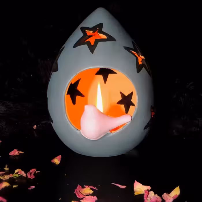 شمعدان سفالی رنگ شده طرح ستاره و پرنده طوسی و صورتی ارتفاع 15 سانتی‌متر