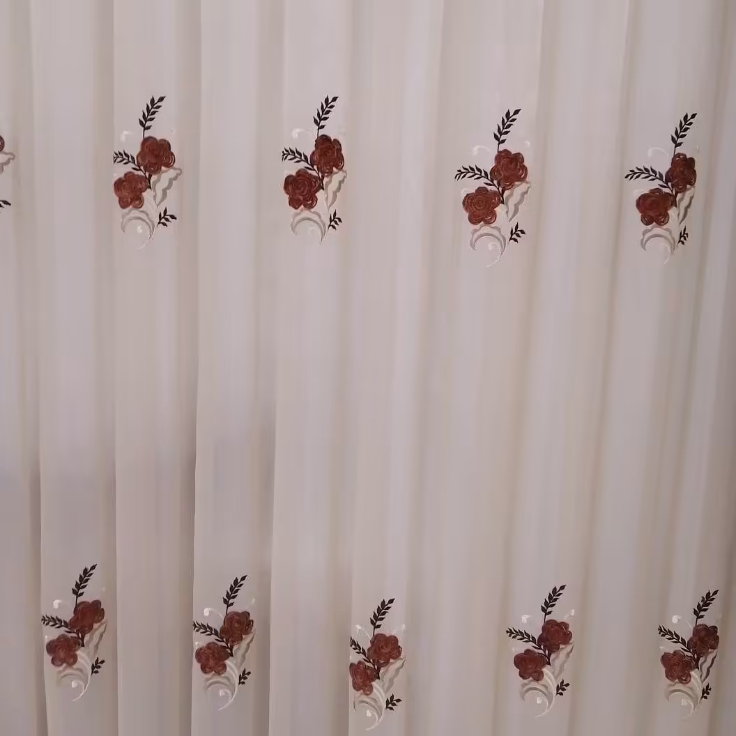 پرده ابریشم با گل رمان دوزی ترک در رنگ کرم و قهوه ای و صورتی کالباسی عرض سه متر (پس کرایه)