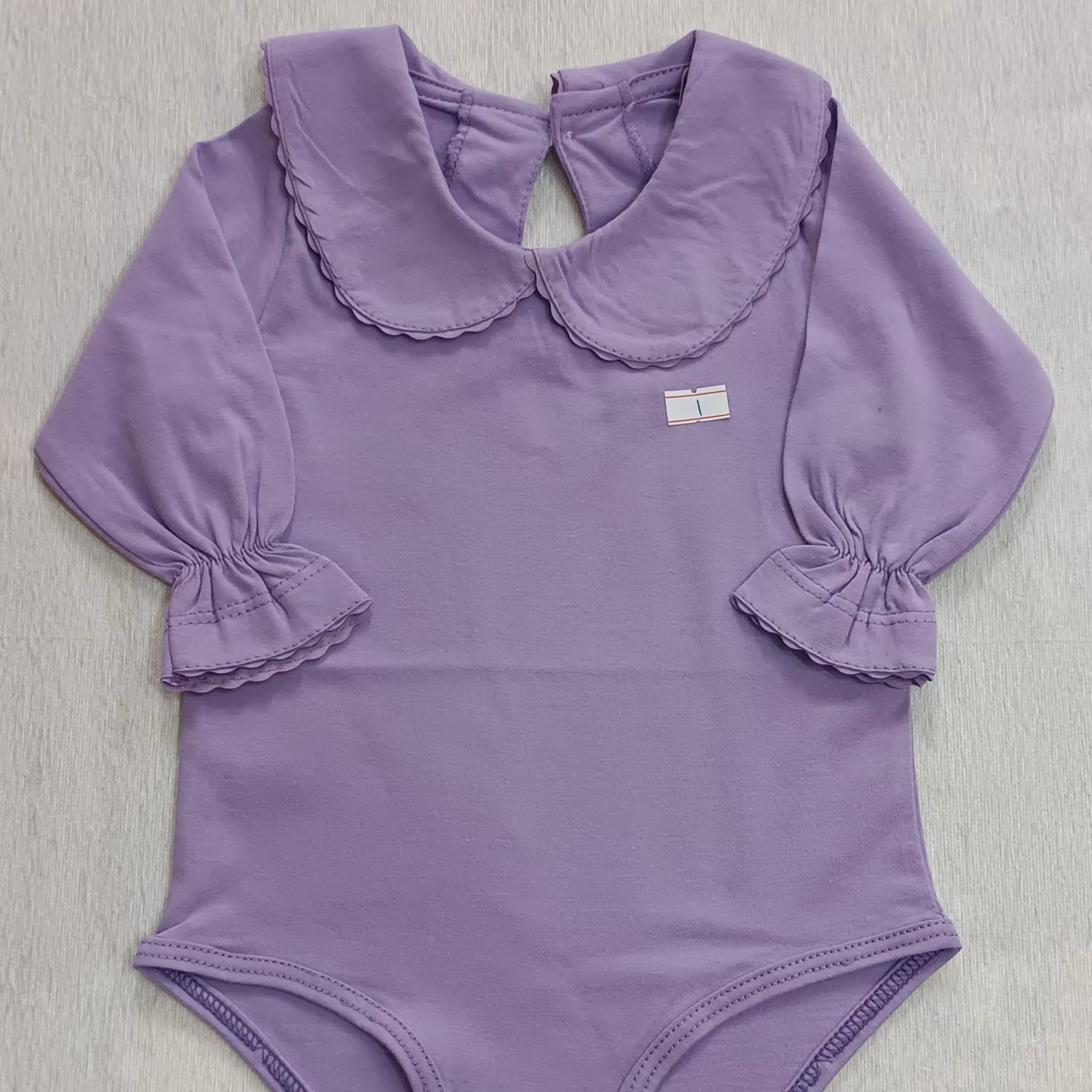 بادی نوزادی یقه ب ب  پشت دکمه خور  رنگ بنفش موجود در پنج سایز 