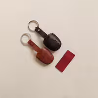 جاسوئیچی چرمی پراید کوئیک و تیبا2 کاور چرمی ریموت سوییچ سایپا سه کلید روکش چرم طبیعی سایپا 