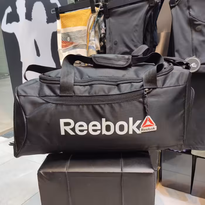 ساک ورزشی ریباک سه حالته جاکفشی دار تک رنگ