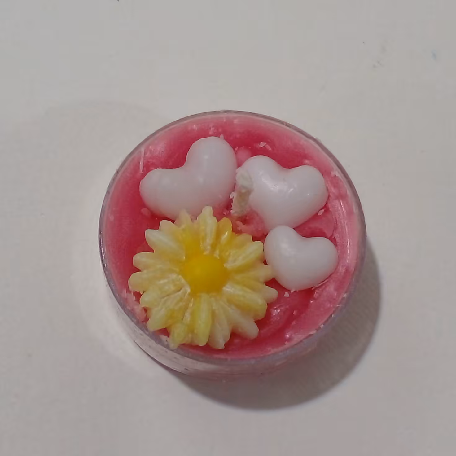 شمع وارمر دست ساز  صورتی طرح قلب و گل بابونه وزن 19 گرمی قطر 4 سانتی طول 2 سانتی