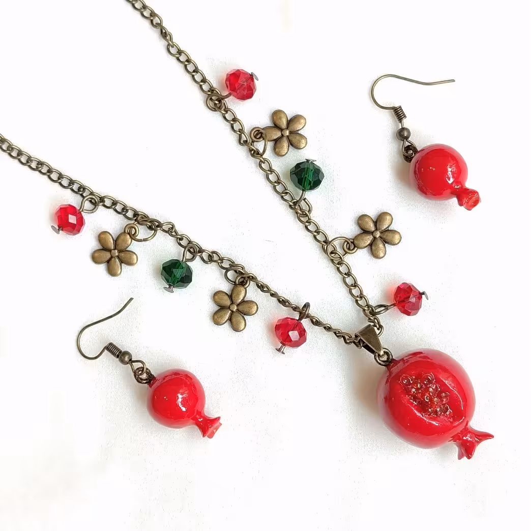 نیم ست انار یلدا یلدایی  زنجیر بلند دانه انار بدلیجات یلدا زیورآلات یلدا