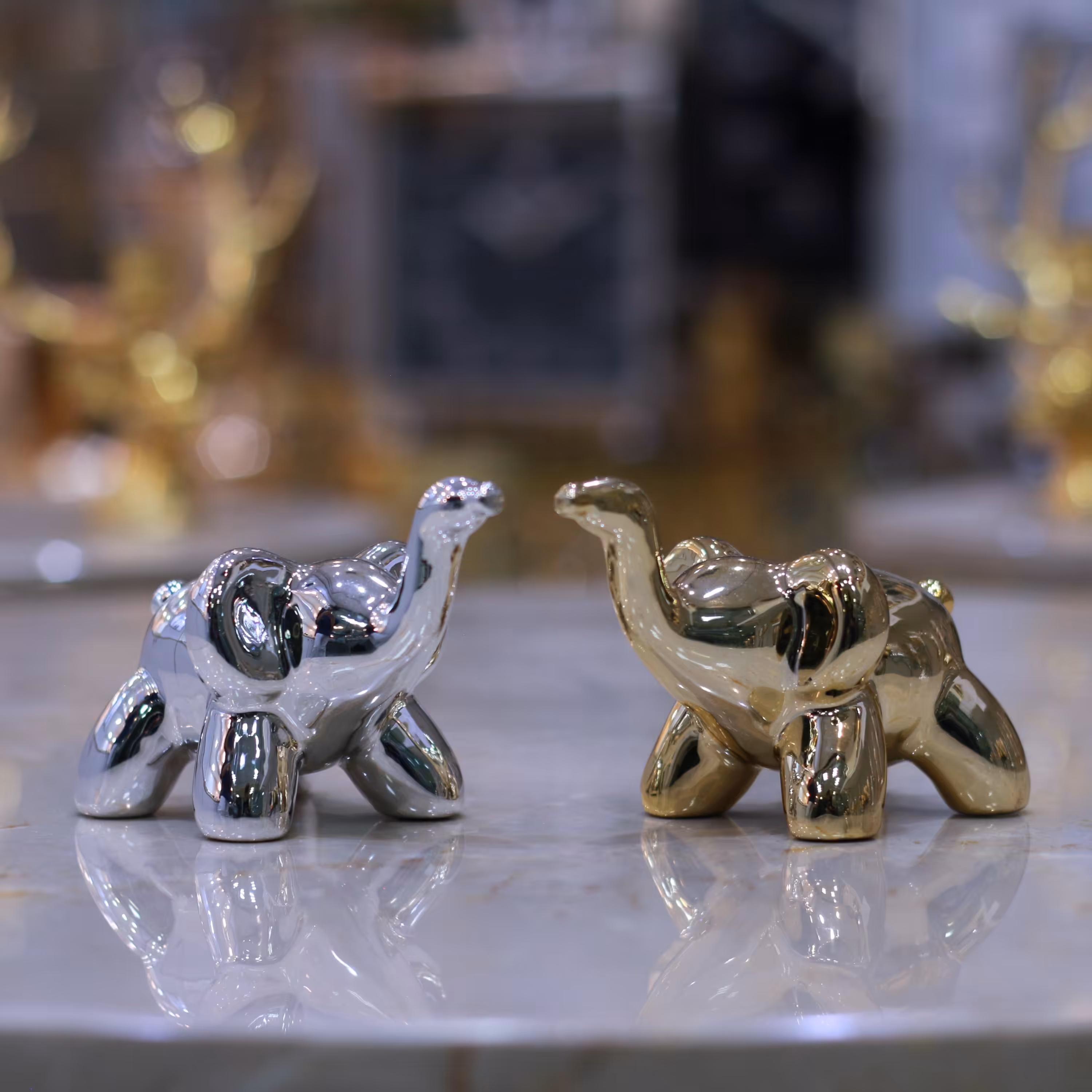 اکسسوری مجسمه فیل سرامیکی طلایی و نقره ای 