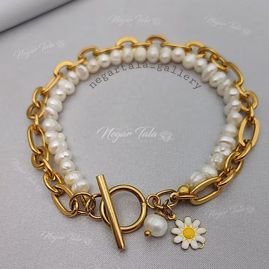 دستبند مروارید پرورشی استیل آویزدار مروارید پرورشی گل بابونه رنگ ثابت قفل تی