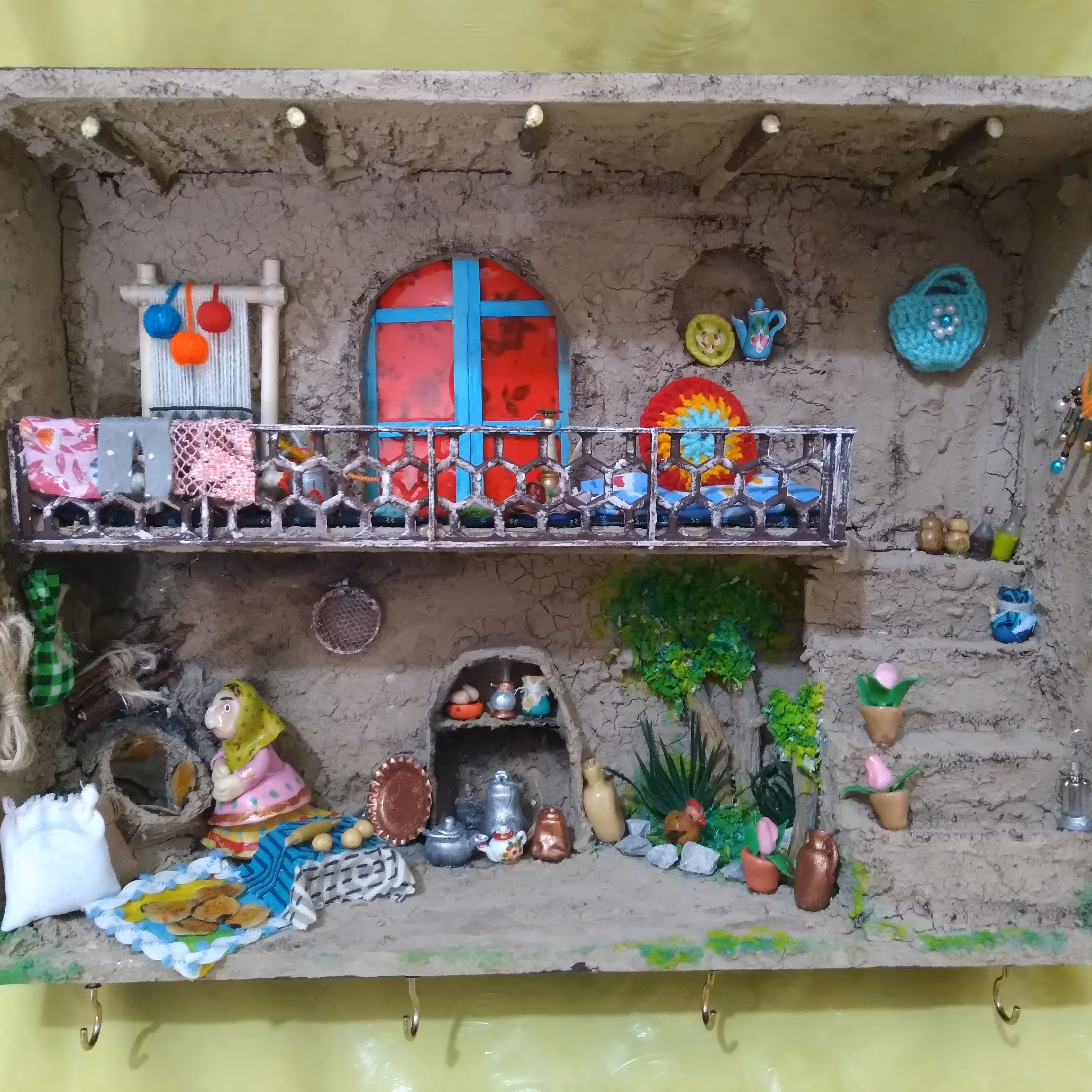 خانه دوطبقه روستایی کاهگلی. محصولی از ستاره چوبی 