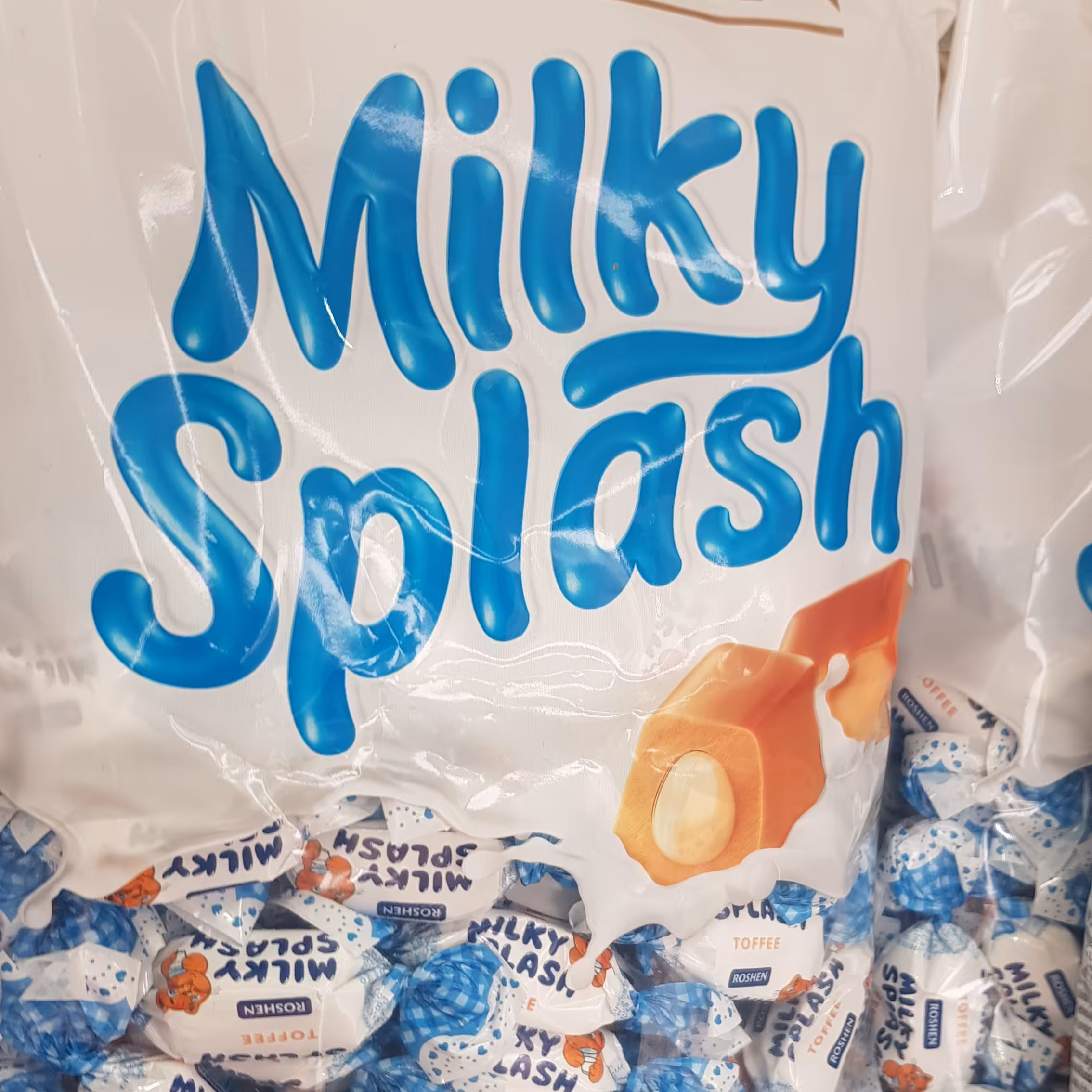 شکلات .برند اوکراین روژن مغزدار milky splashبسته 1کیلوئی