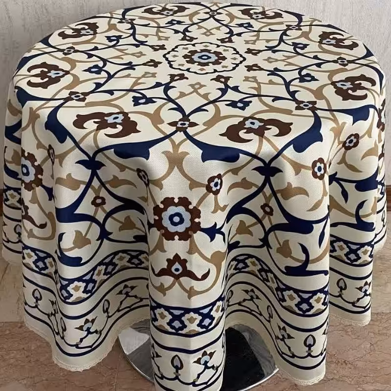 رومیزی گرد    جنس کتان هازان  قطر145سانتیمتر   دوردوزی شده با نوار تور کنفی     زمینه کرم و طرح  اسلیمی 