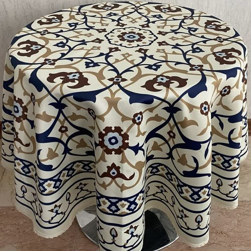 رومیزی گرد    جنس کتان هازان  قطر145سانتیمتر   دوردوزی شده با نوار تور کنفی     زمینه کرم و طرح  اسلیمی