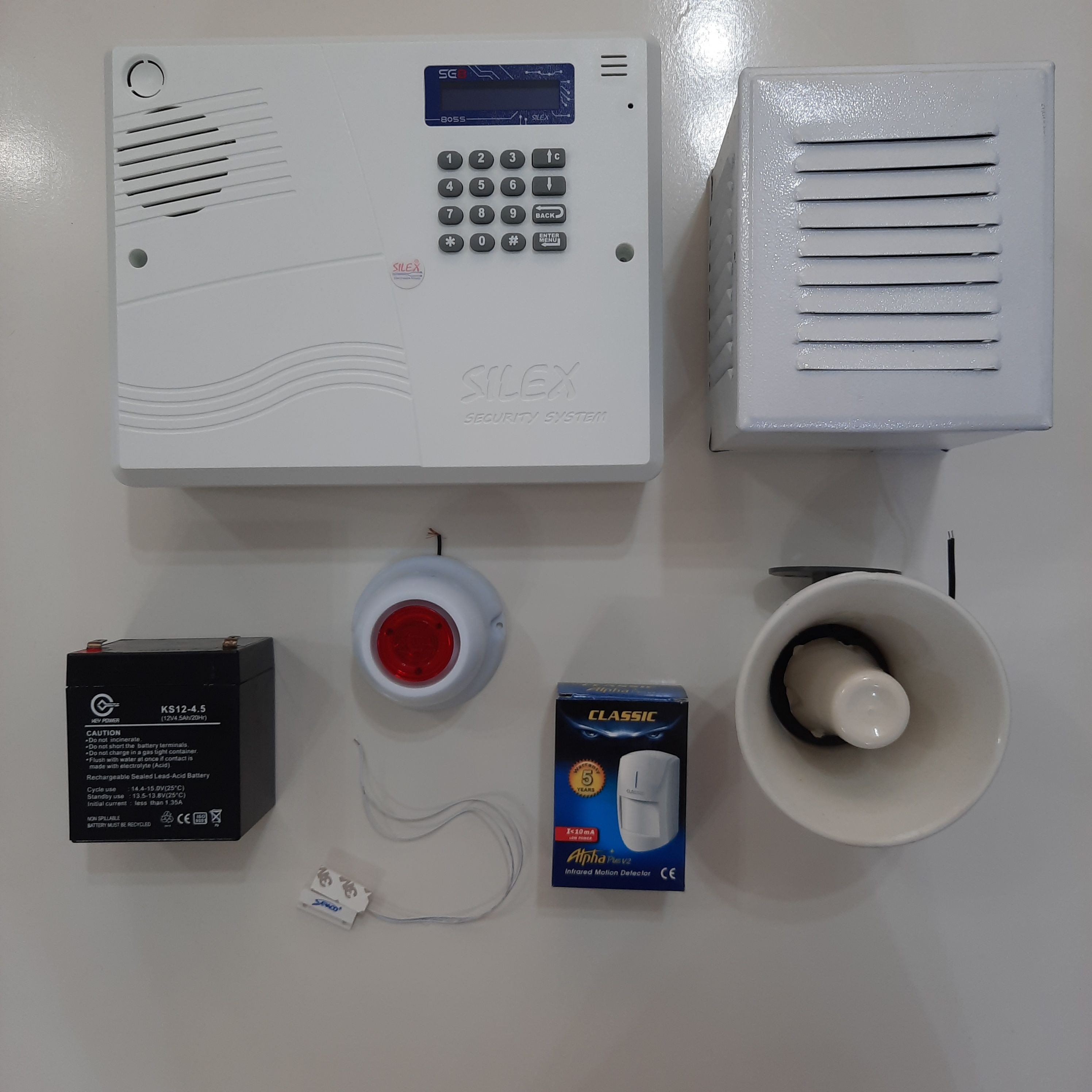 پکیج کامل دزدگیر اماکن برند سایلکس . چشمی کلاسیک .پیزوالکتریک  .بلندگو .کاور بلندگو فلزی . باطری 4.5 آمپر . سنسور مگنت