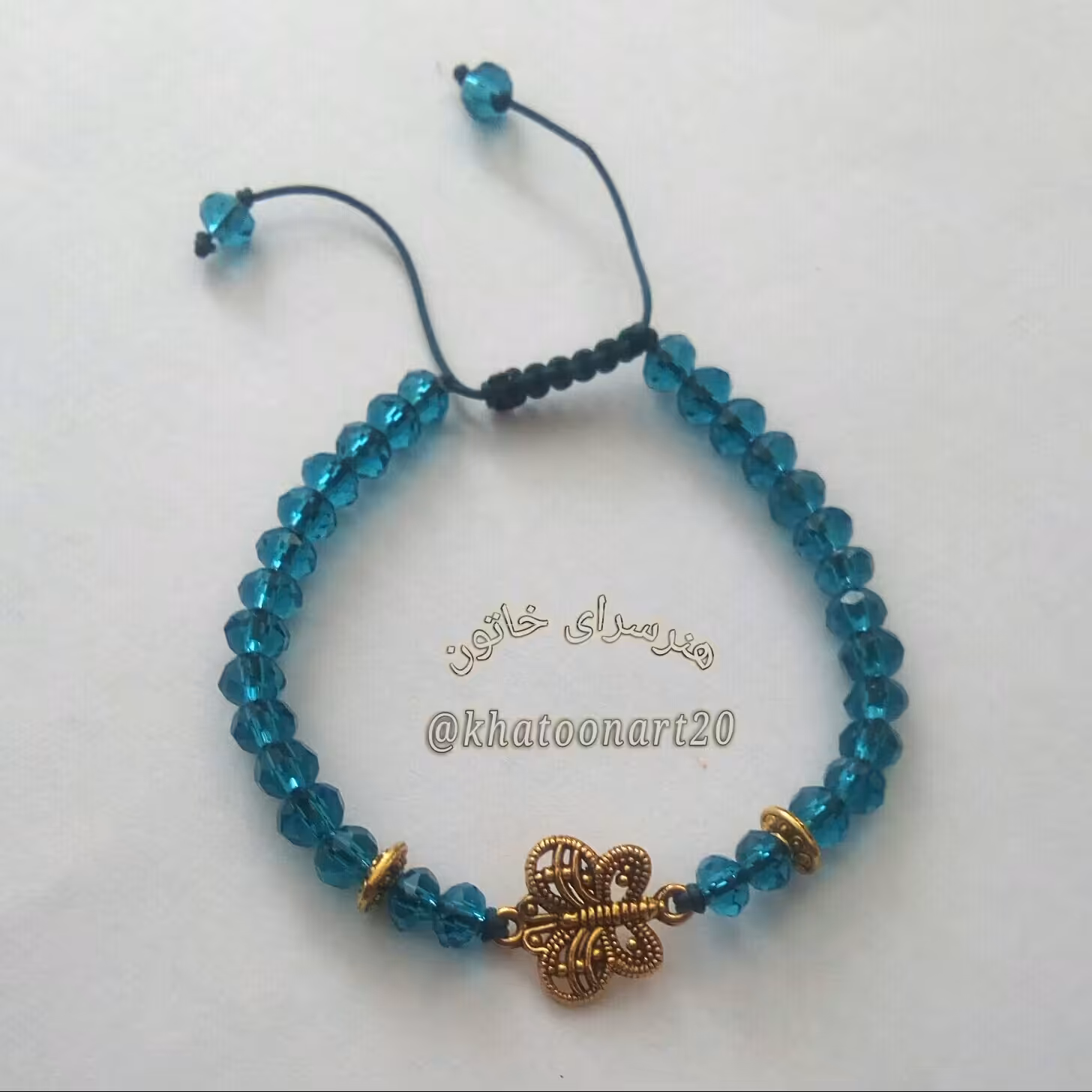 دستبند کریستالی سبزآبی با طرح پروانه