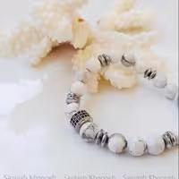 دستبند کشی هائولیت با سنگ حدید و مهره استیل رنگ ثابت