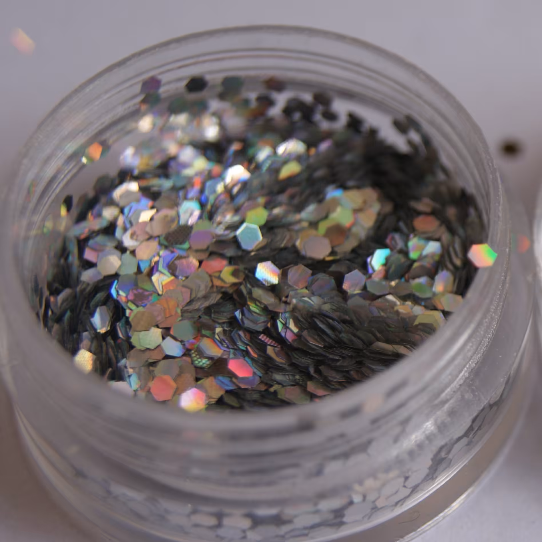 اکلیل درشت هولوگرامی رنگ نقره ای هفت رنگ طرح چندضلعی