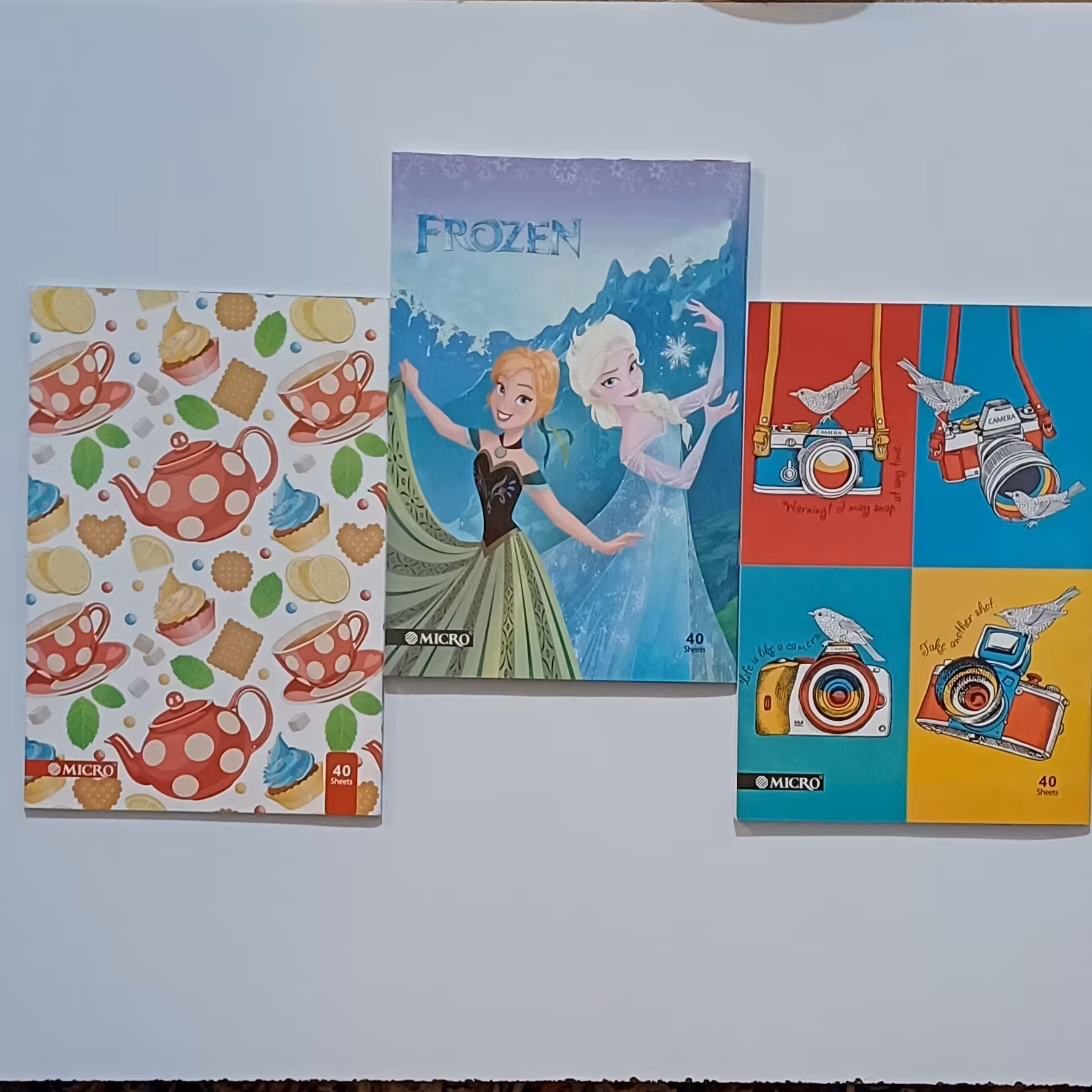 دفتر 40 برگ منگنه ای خط دارکیفیت عالی و خطوط پررنگ در طرحهای متنوع دخترانه و پسرانه 