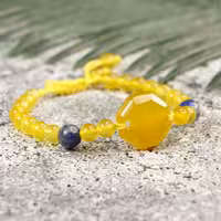 
دستبند عقیق زرد و لاجورد و میانکار عقیق زرد شرف الشمس 
