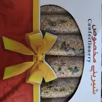 معجون کنجدی رولی بسته های 870 گرمی با مخلوط مغزهای گردو بادام تخمه و تزئین پسته جنگلی 