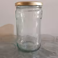 جار شیشه ای با درب فلزی.ظرفیت 850گرم عسل (40عدد)