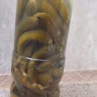 خیارشور ویژه ( ریز و قلمی ) تازه ،  عسلکده حکیم در بسته بندی بطری