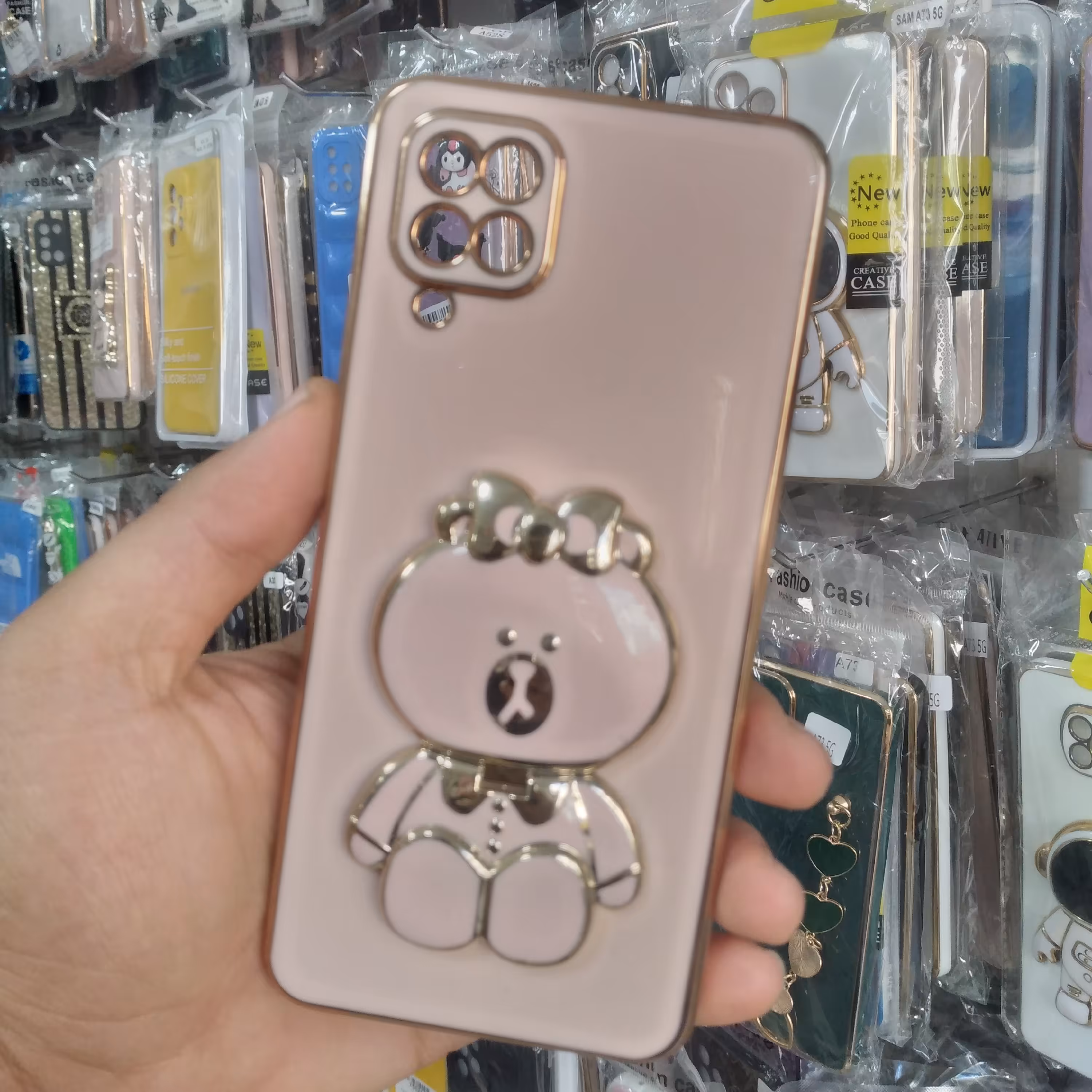 قاب گوشیa12قاب گوشی آینه ای استند خرسی رنگ صورتی شیک فانتزی