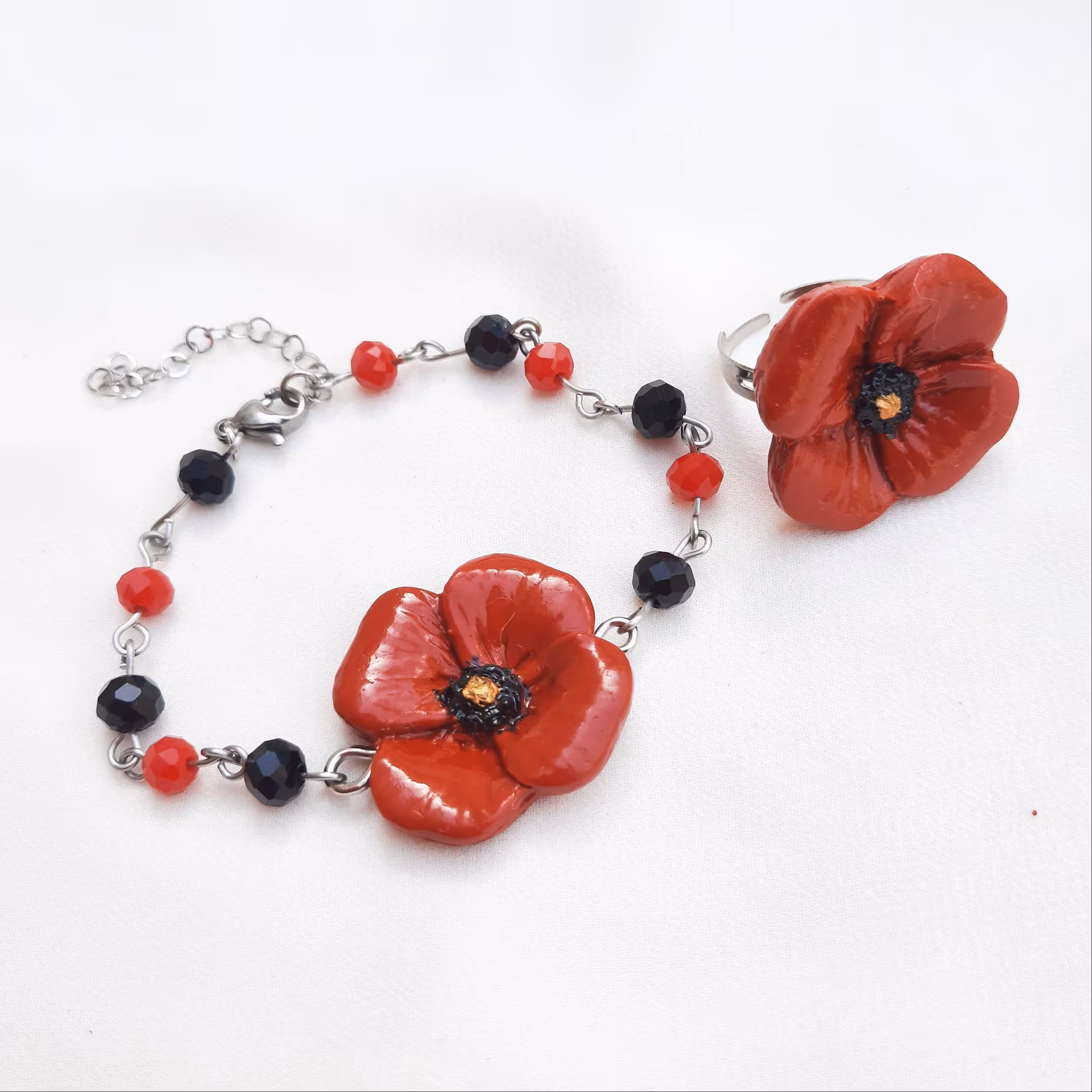 نیم ست گل شقایق استیل انگشتر و دستبند قابل تنظیم سایز رنگ ثابت