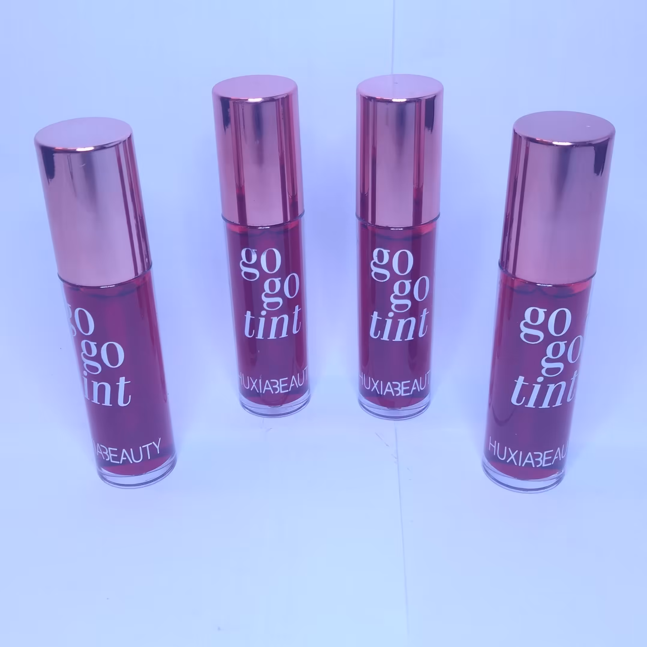 تینت لب هوکسا بیوتی huxabeauty رنگ نارنجی لایت go