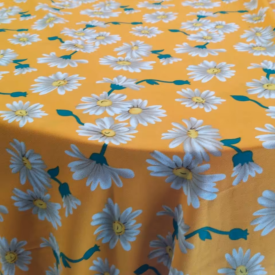 پارچه نخی بوگاتی طرح گل بابونه زمینه زرد عرض1.5