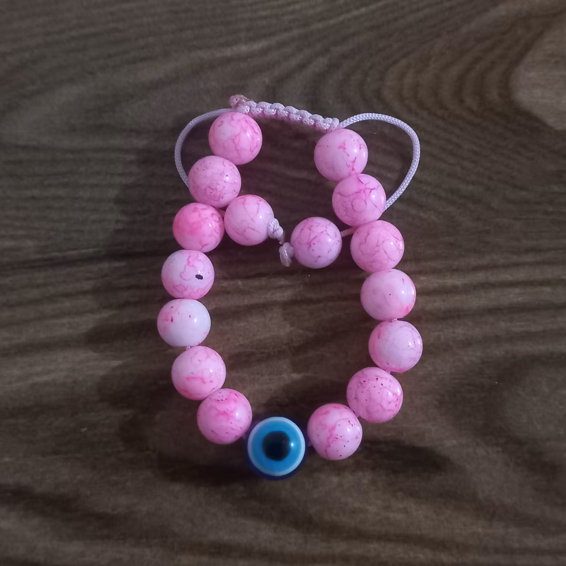 دستبند صورتی آبرنگی، بافت کشویی، چشم نظر