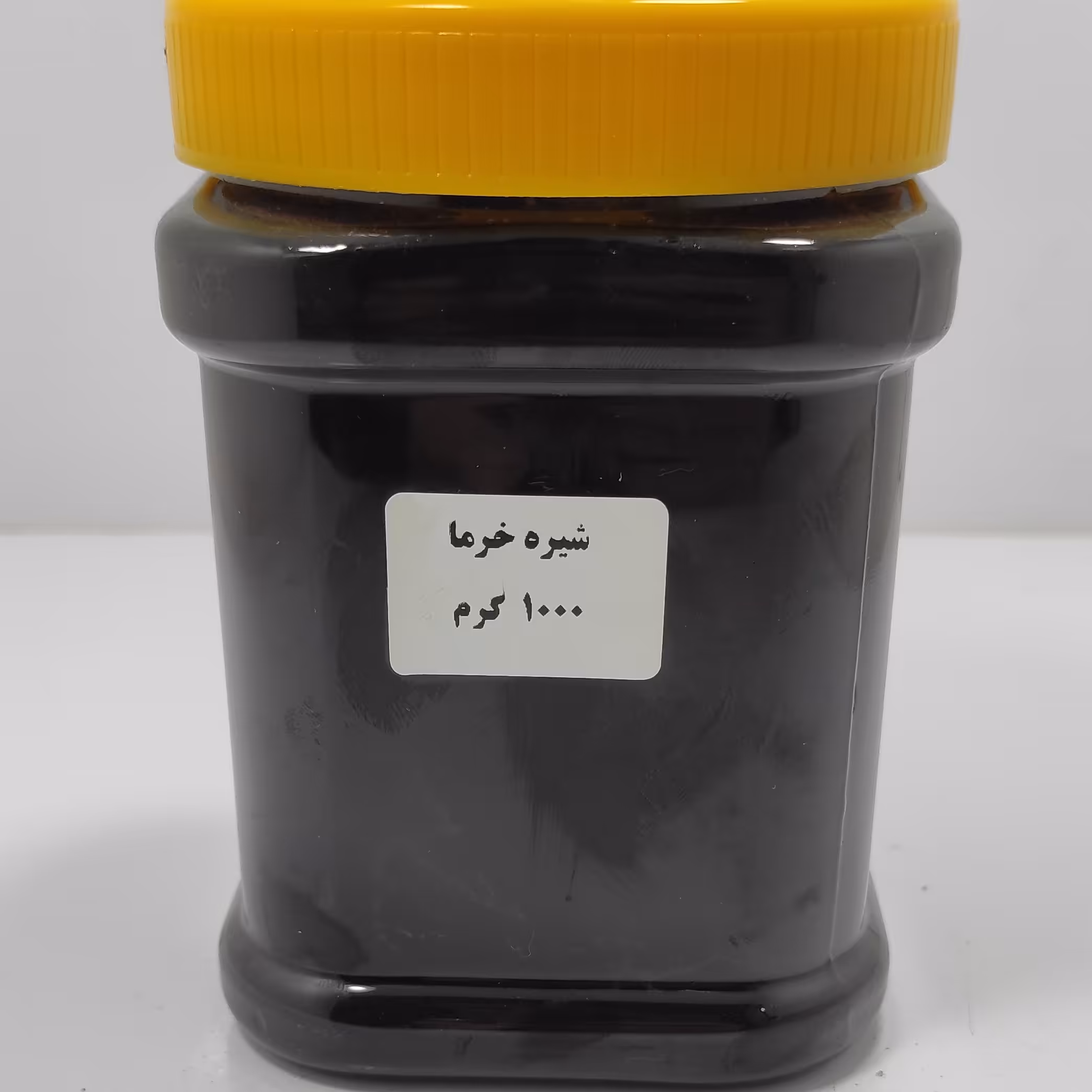 شیره خرما سیاه محلی خالص پک 6 تایی عمده (1 کیلویی)